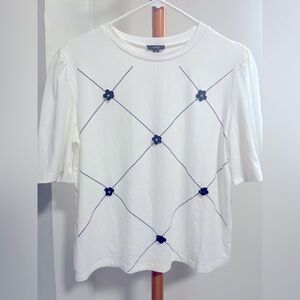 White Top with Black Floral Accents